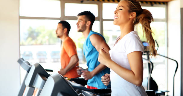 istock Young attractive woman doing cardio training in gym 879176964
