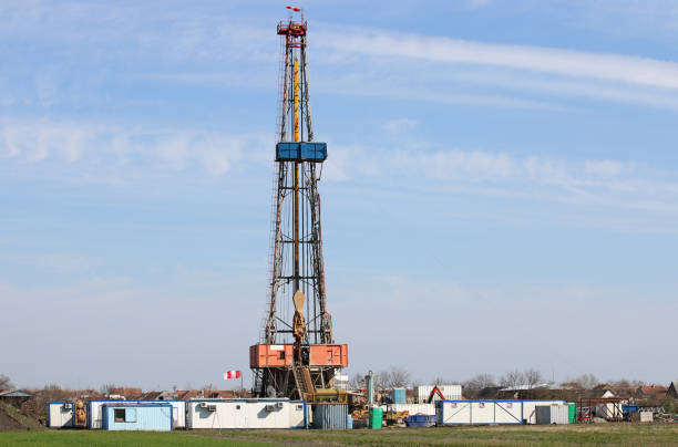 istock Land oil drilling rig on field 879180154