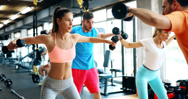 istock Beautiful women working out in gym 879185630