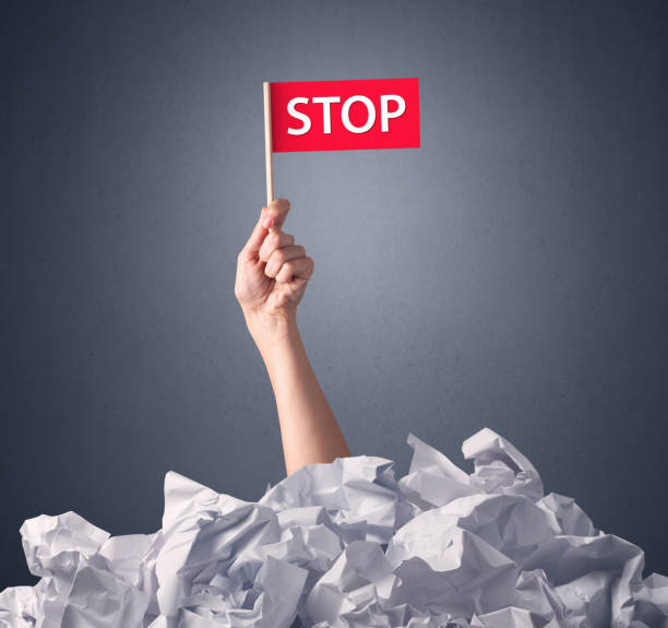 istock Female hand holding stop sign 879198886