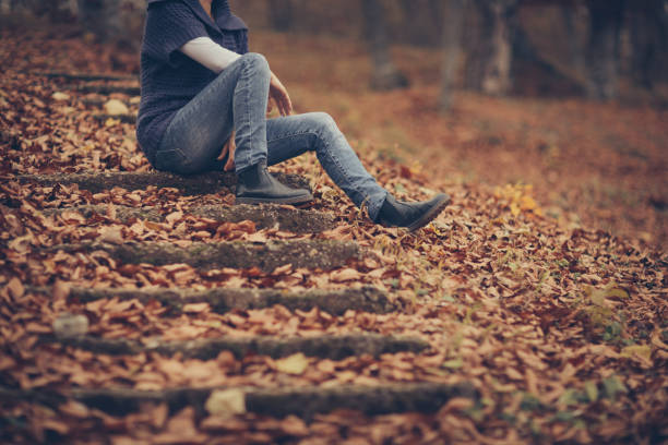 istock Happy autumn day-woman in forest 879203106