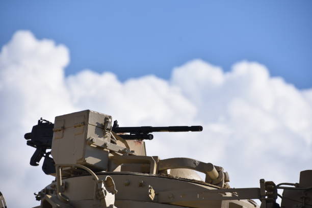 istock A machine gun in the background of dramatic skies 879217810