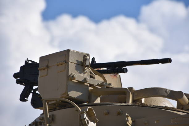 istock A machine gun in the background of dramatic skies 879217818