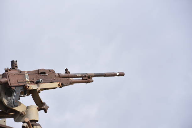istock A machine gun in the background of dramatic skies 879222680