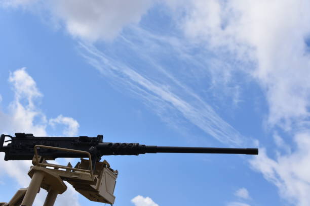 istock A machine gun in the background of dramatic skies 879222996