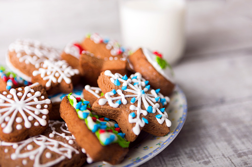 Gingerbread cookies decorated with icing and milk