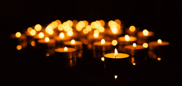 istock Burning candles with shallow depth of field 879240546