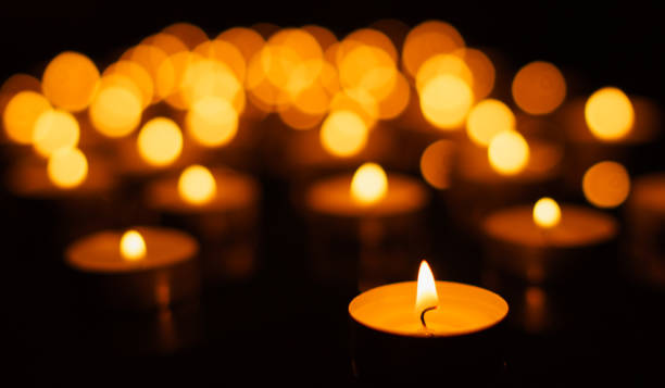 istock Burning candles with shallow depth of field 879240636