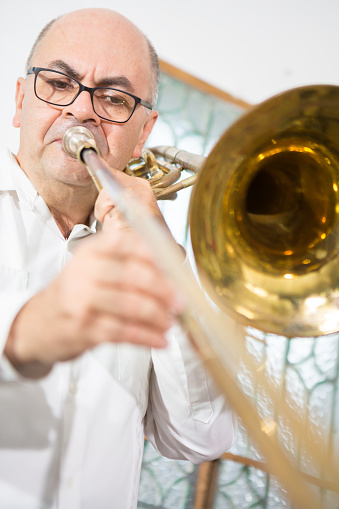 Slide trombone player close-up