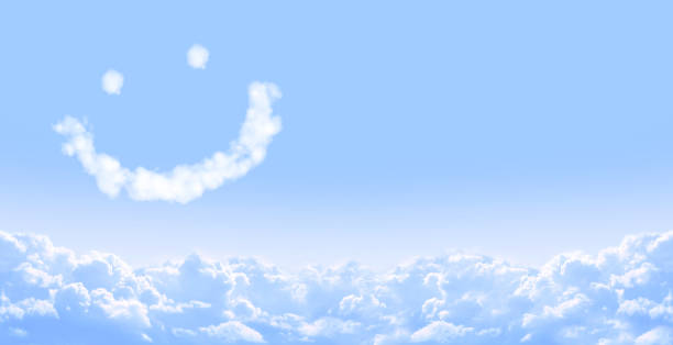 Smilie from cloud in blue sky Horizontal banner with smilie from cloud and white clouds in the blue sky anthropomorphic smiley face photos stock pictures, royalty-free photos & images
