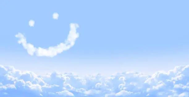 Horizontal banner with smilie from cloud and white clouds in the blue sky