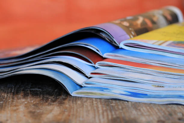 Magazines on the wooden table stock photo