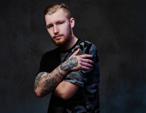istock A man with tattoos on arms. 879258252