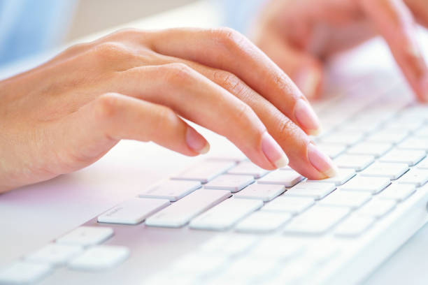 istock Female woman office worker typing on the keyboard 879258948