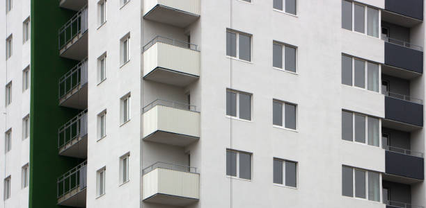 istock The facade of a typical block multi-storey residential building. Front view close up 879261422