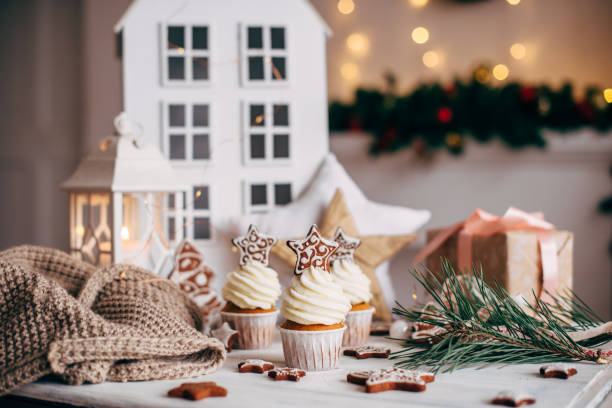 istock Christmas delicious cupcakes decorated with a gingerbread star. 879264544