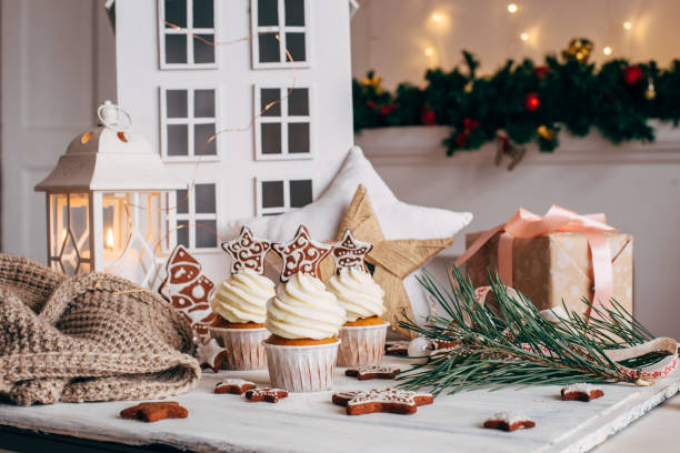 istock Christmas delicious cupcakes decorated with a gingerbread star. 879264620