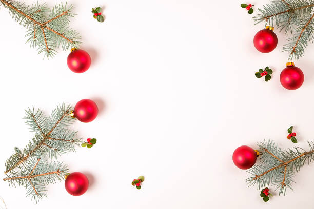 istock Christmas frame composition. Christmas gift,pine branch, red balls, envelope, white wood snowflakes, ribbon and red berries. Top view, flat lay, copy space 879273264