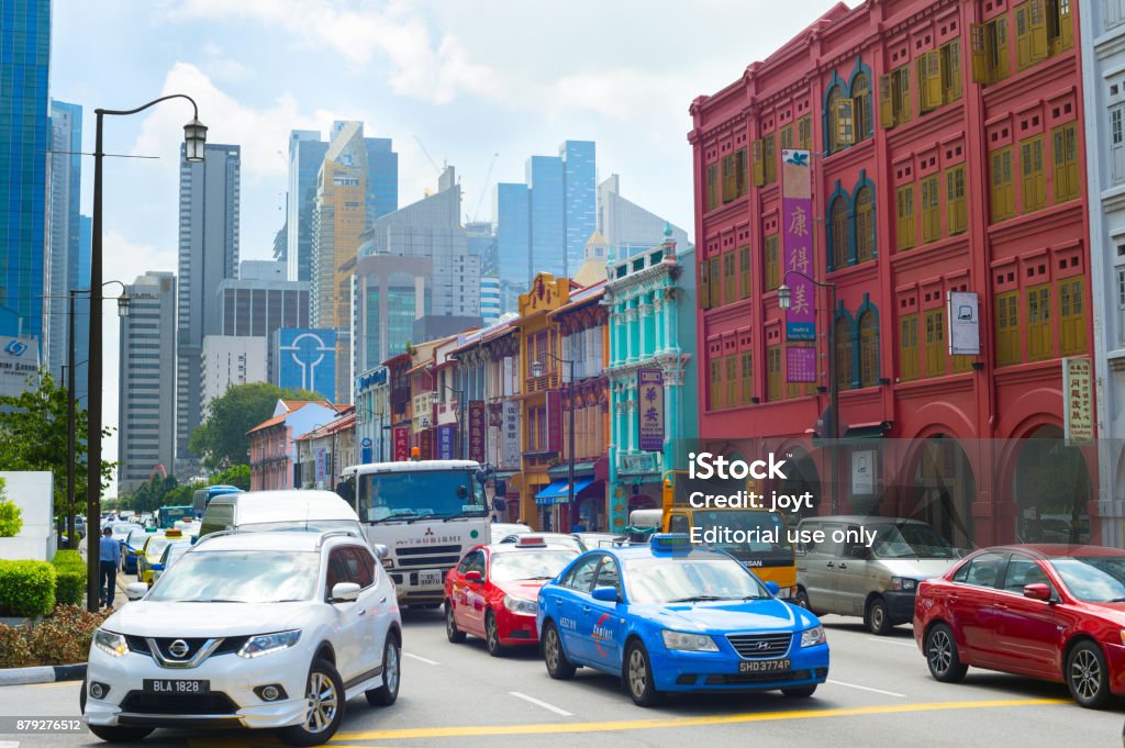 Traffic at rush hour, Singapore SINGAPORE - FEB 17, 2017: Busy traffic on a road in Chinatown in Singapore. Chinatown is an ethnic enclave located within the Outram district in the Central Area of Singapore. Singapore Stock Photo