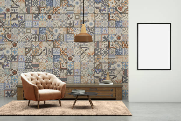 istock Blank picture frame on gray wall with armchair in front 879279988