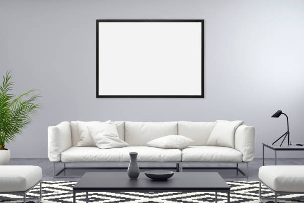 cornice bianca su parete grigia con divano di fronte - canvas artists canvas picture frame frame foto e immagini stock
