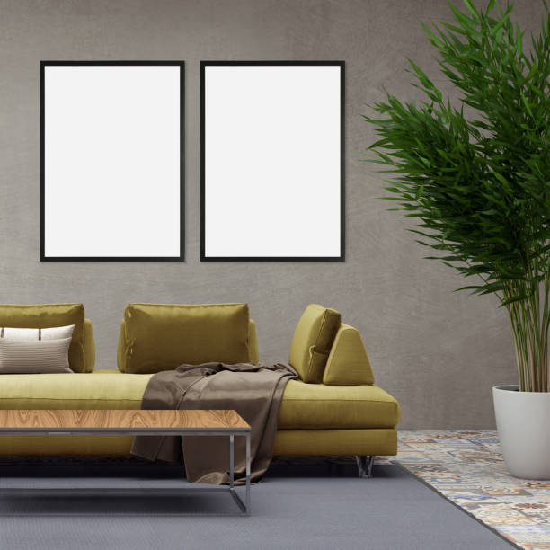 istock Blank picture frame on gray wall with sofa in front of it 879280016