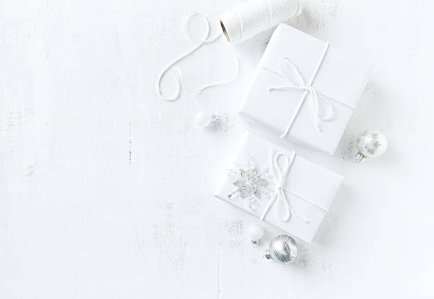 Christmas presents with Christmas decorations on white painted background stock photo