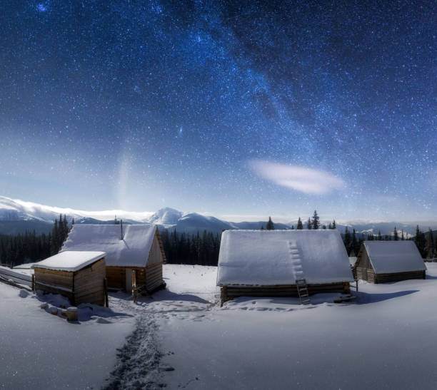istock Night landscape glowing by milky way 879283820