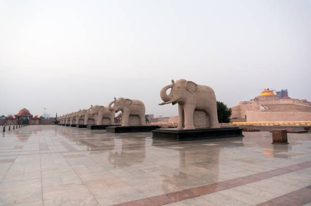 istock Statues of elephants placed in a straight line 879287162