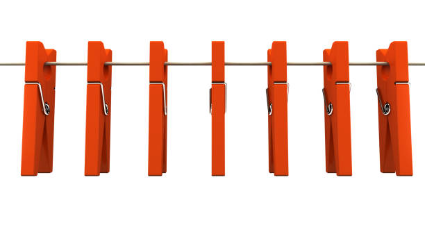 istock Red wooden clothespins on rope 879293552