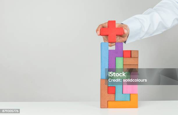 Final Touch To Achievement Stock Photo - Download Image Now - Plus Sign, Toy Block, Concepts