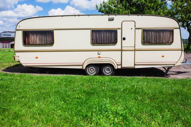 istock A new trailer stands on a summer background. 879311978