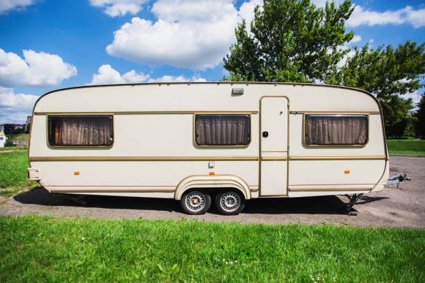 istock A new trailer stands on a summer background. 879318472