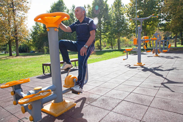 istock Senior men   exercising  on outdoor gym 879318528