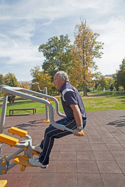 istock Senior men   exercising  on outdoor gym 879321480