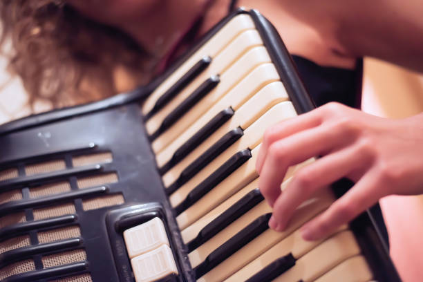 istock Young Woman with old Accordion 879321926