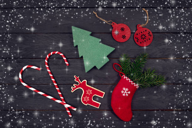 istock Traditional Christmas decoration on black background. Top view, copy space, snow texture 879322126