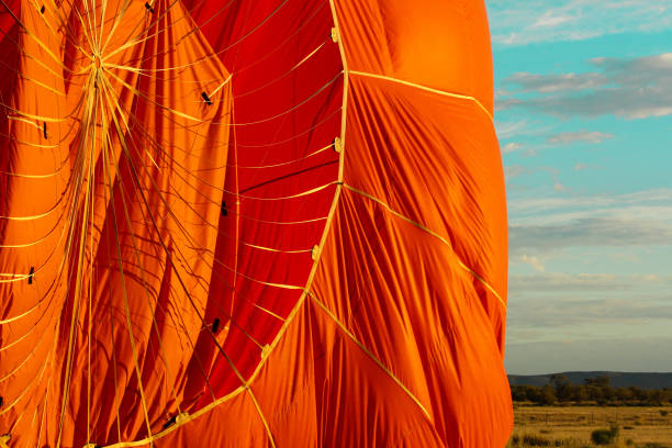 istock hot air balloon deflating after landing 879343572