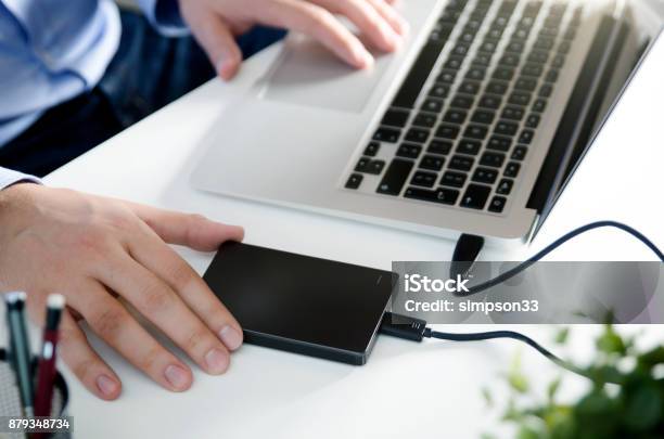 External Backup Disk Hard Drive Connected To Laptop Stock Photo - Download Image Now