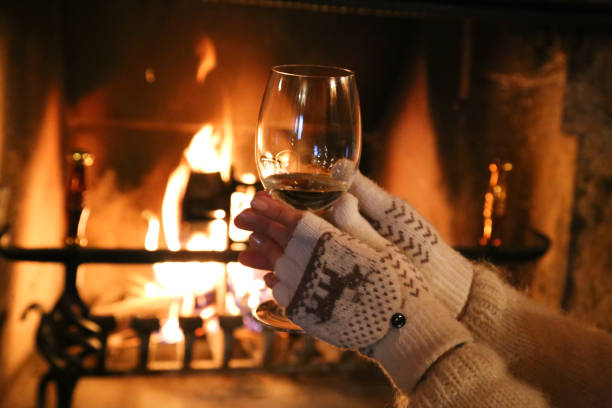 istock glasses with wine by the fireplace 879351326