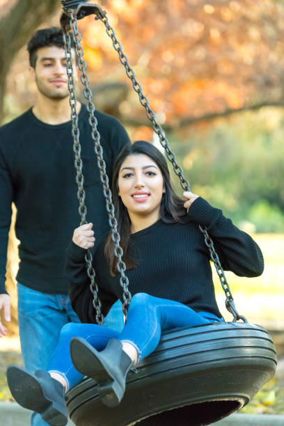 istock young couple having fun at the park 879351576