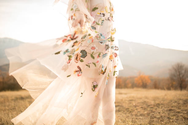 istock Boho lady in a white romantic dress outdoors 879364134