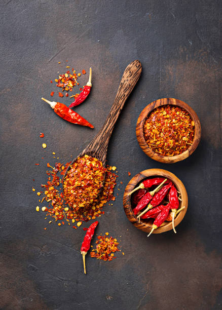 istock Red hot chili peppers on rusty background 879364504