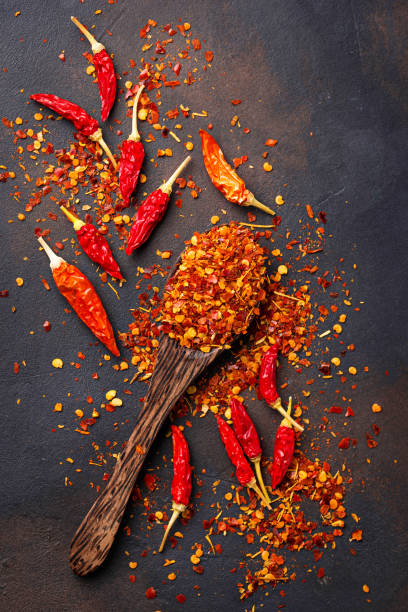 istock Red hot chili peppers on rusty background 879364896