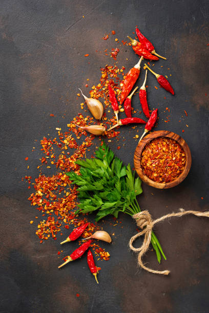 istock Red chili peppers, garlic and parsley 879367136
