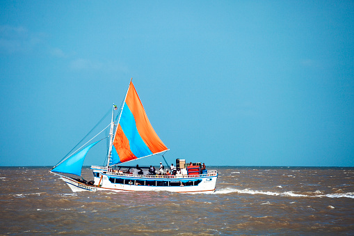 Sao Luis, Brazil - February 5, 2013: River transport - sailboat takes passengers from Sao Luis to Alcantara.