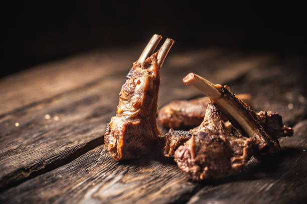 istock Grilled lamb chops on wooden table 879383306