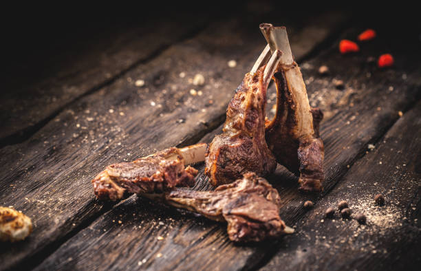 istock Grilled lamb chops on wooden table 879383362