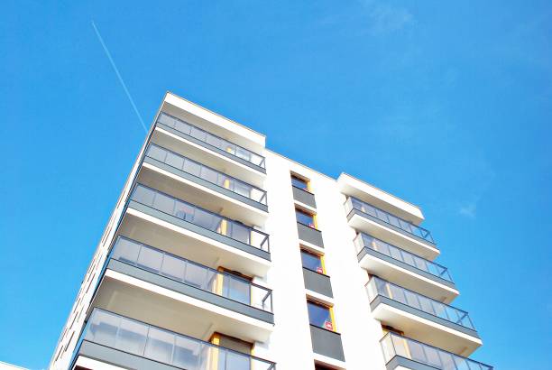 istock Modern apartment buildings on a sunny day with a blue sky. 879393576