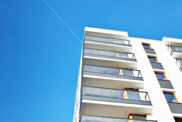 istock Modern apartment buildings on a sunny day with a blue sky. 879393622